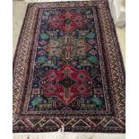 A Caucasian blue ground rug, 186 x 124cm