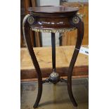 A French gilt metal mounted mahogany Empire style vase stand, height 67cm and an Arts and Crafts
