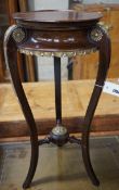 A French gilt metal mounted mahogany Empire style vase stand, height 67cm and an Arts and Crafts