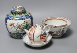 A Chinese ginger jar and cover, two tea bowls and a miniature teapot, tallest 16cm