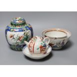 A Chinese ginger jar and cover, two tea bowls and a miniature teapot, tallest 16cm