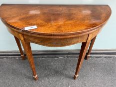 A George III inlaid mahogany demi-lune folding tea table, width 96cm, depth 45cm, height 74cm