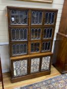 A Globe Wernicke type oak sectional bookcase, enclosed by leaded glazed doors, width 103cm, depth