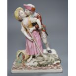 A 19th century Continental figure group of a huntsman embracing a female peasant, 23cm