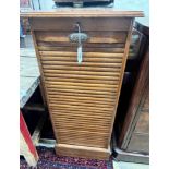 An early 20th century oak tambour filing cabinet, width 50cm, depth 42cm, height 115cm