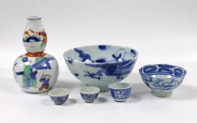 A selection of small Chinese ceramics, to include a blue and white dragon bowl, 6cm tall, a double