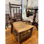 A Victorian bobbin turned rush seat chair