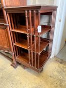 An Edwardian walnut revolving bookcase, width 60cm, height 120cm