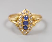 An early 20th century yellow metal, sapphire and diamond set marquise shaped cluster ring, with