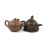 A Chinese Yixing reticulated teapot and cover and another