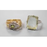 An 18ct white metal and paste set ring, gross 6.1 grams, and one other continental diamond and