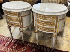 A pair of oval French marble topped bedside cabinets, width 51cm, depth 48cm, height 70cm