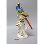 An early 20th century Meissen porcelain model of a perched parrot, 31.5cm tall