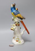 An early 20th century Meissen porcelain model of a perched parrot, 31.5cm tall