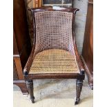 A Regency simulated rosewood caned bergere chair