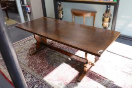 A Titchmarsh and Godwin rectangular oak refectory dining table, length 213cm, width 90cm, height