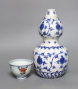 A Chinese blue and white double gourd vase, together with a Chinese famille verte bowl, tallest