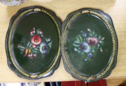 A pair of toleware trays painted with flowers, 34cm wide