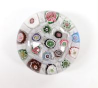A Clichy glass paperweight with Clichy rose