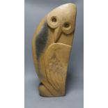 A Zimbabwean carved and polished stone figure of a stylised winged bird, with a long neck. 64cm