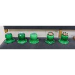 Two pairs of brass and green glass wall lights and one other