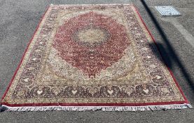 A Kashmiri part silk burgundy ground floral carpet, 330 x 240cm