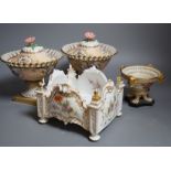 A pair of 19th century continental porcelain tazzas together with a smaller example and planter (4),