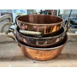 Three Victorian circular copper two handled preserve pans, largest diameter 43cm