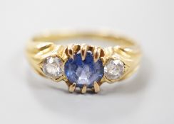 A late Victorian 18ct gold, sapphire and diamond set three stone ring, size I, gross weight 3