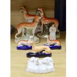 A Staffordshire pottery figure of John Wesley, six Staffordshire pottery models of hounds, and a