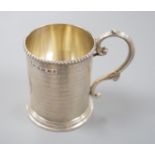 A Victorian engine turned silver christening mug, with engraved inscription, George Unite,