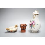 An 18th century English porcelain hot water jug, a Wedgwood two-colour terracotta pot and an early