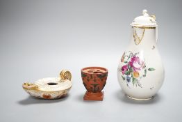 An 18th century English porcelain hot water jug, a Wedgwood two-colour terracotta pot and an early