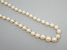 A single strand graduated cultured pearl necklace, with four stone diamond set white metal clasp,