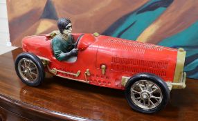 A resin model of an early 20th century Grand Prix racer in a Bugatti type 35