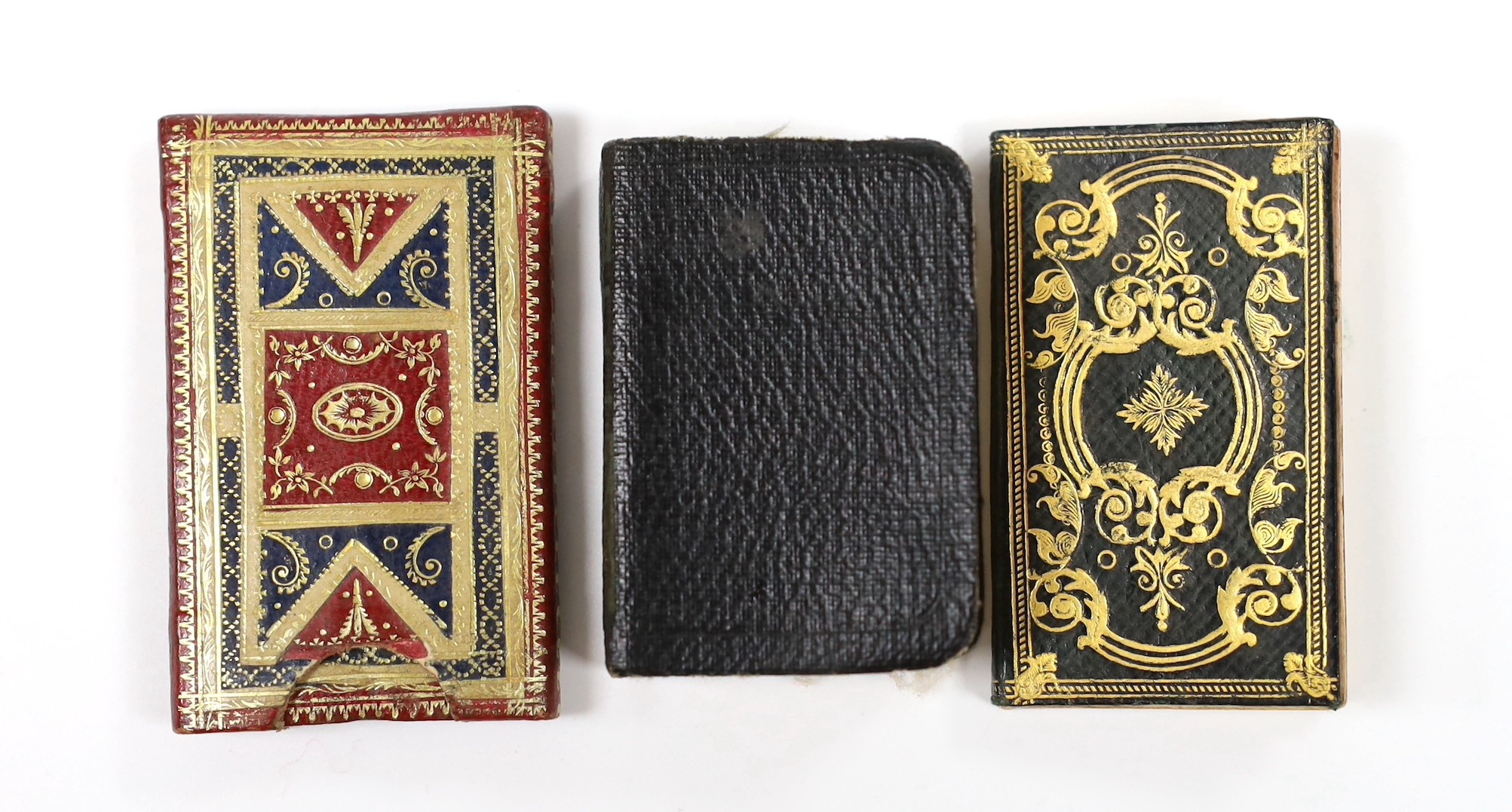 ° ° An 18th century miniature book and two others