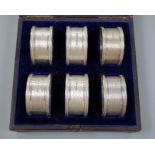 A cased set of six Victorian engraved silver napkin rings, Atkin Brothers, Sheffield, 1876.