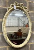 A Victorian style oval painted wall mirror, width 58cm, height 84cm