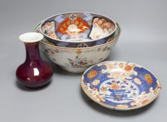 An 18th century Japanese Imari dish (af), another Imari dish, an 18th century Chinese export bowl (