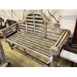 A Lutyens style weathered teak garden bench, length 164cm, depth 56cm, height 103cm