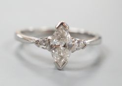 A modern platinum and single stone marquise diamond set ring, with two stone pear cut diamond set