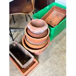 Approximately fifty assorted terracotta garden pots