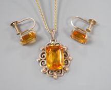 A yellow metal and citrine set pendant, 29mm, on a gold plated chain and a pair of 9ct and citrine