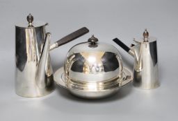 Two silver plated cafe au lait pots one with double wall interior and a muffin dish
