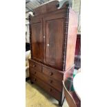A Regency mahogany linen press, converted to a hanging wardrobe, width 122cm depth 55cm height