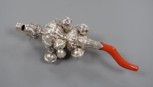 A late 19th/early 20th century white metal and coral set child's rattle, maker's mark only for