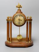 A small French portico clock with column decoration, 29cm tall