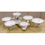 Six pieces of Moore Bros. white glazed gilt edged porcelain, including a set of four comport, 20cm