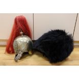 A Royal Horseguard's helmet and Queen’s guard bearskin
