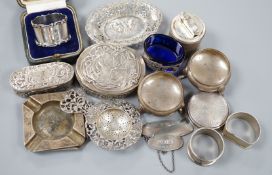 A collection of small silver items including napkin rings, repousse oval boxes, pair of bun salts,